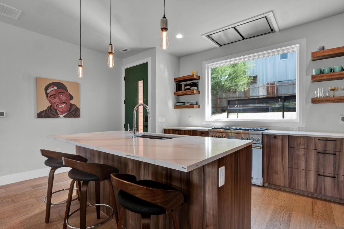 1914 East 8th Street Austin, TX 78702 - Photo 16 of 40 a view of a dining room with furniture window and wooden floor