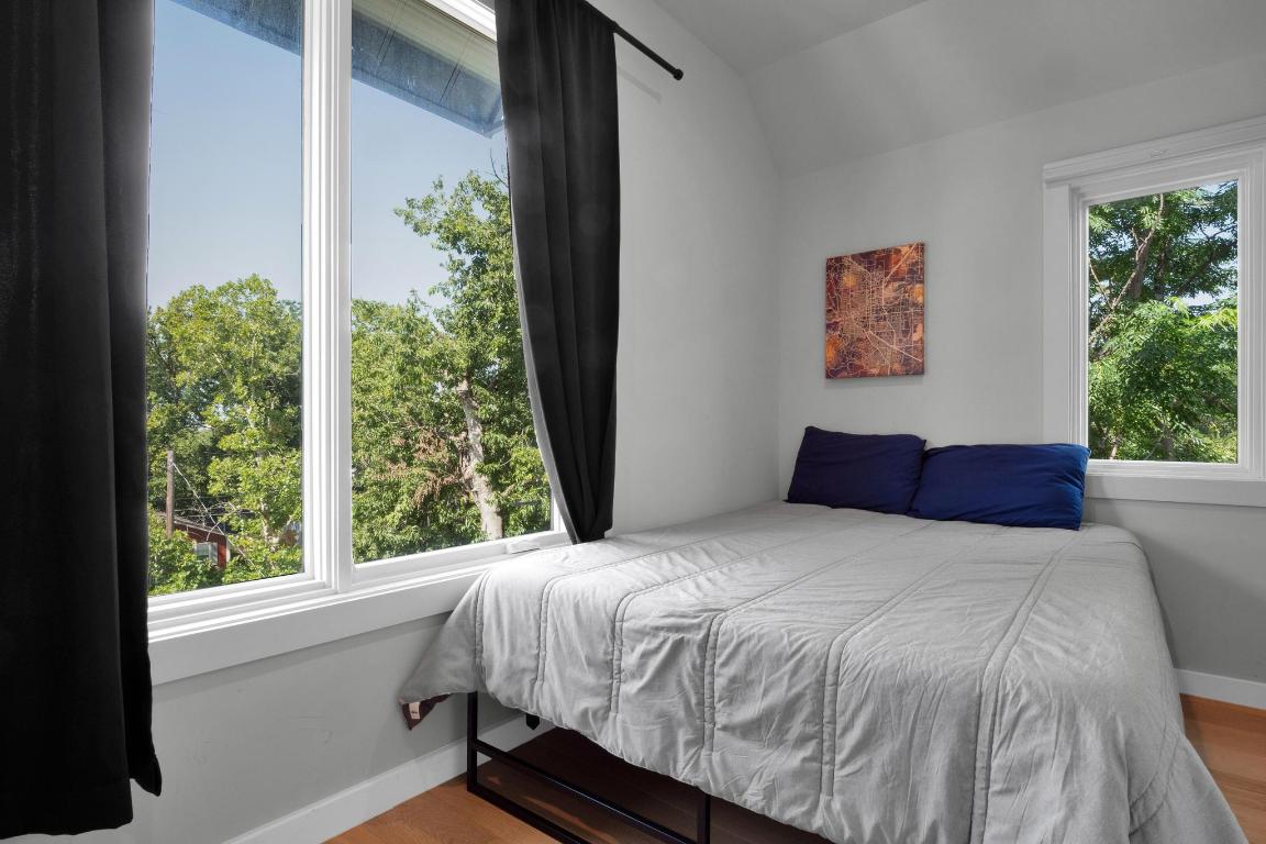 1914 East 8th Street Austin, TX 78702 - Photo 23 of 40 a bedroom with a large bed and a window