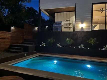 a room with pool table and chairs