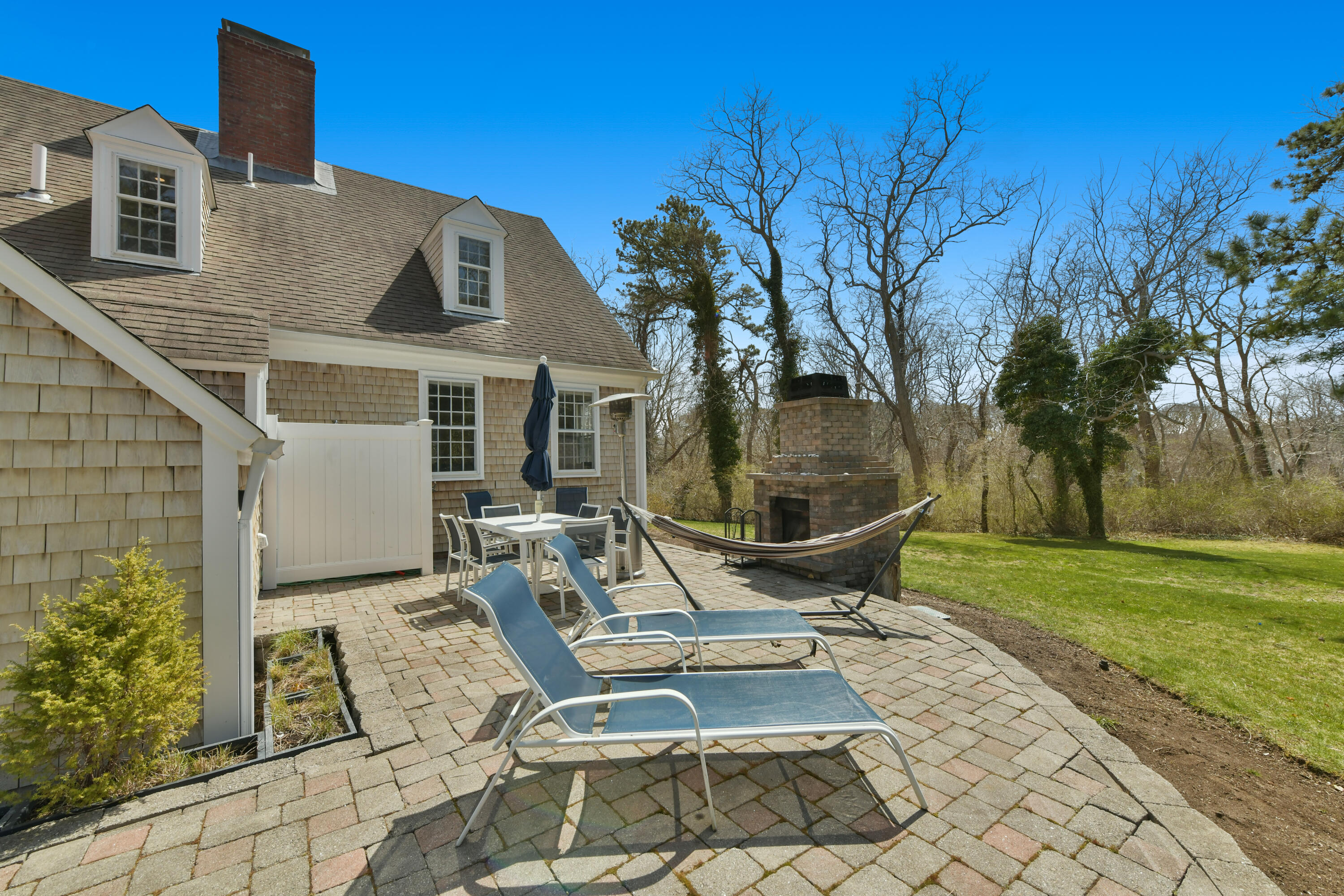 588 South Orleans Road Orleans, MA 02653 - Photo 22 of 43 Patio with Outdoor Fireplace