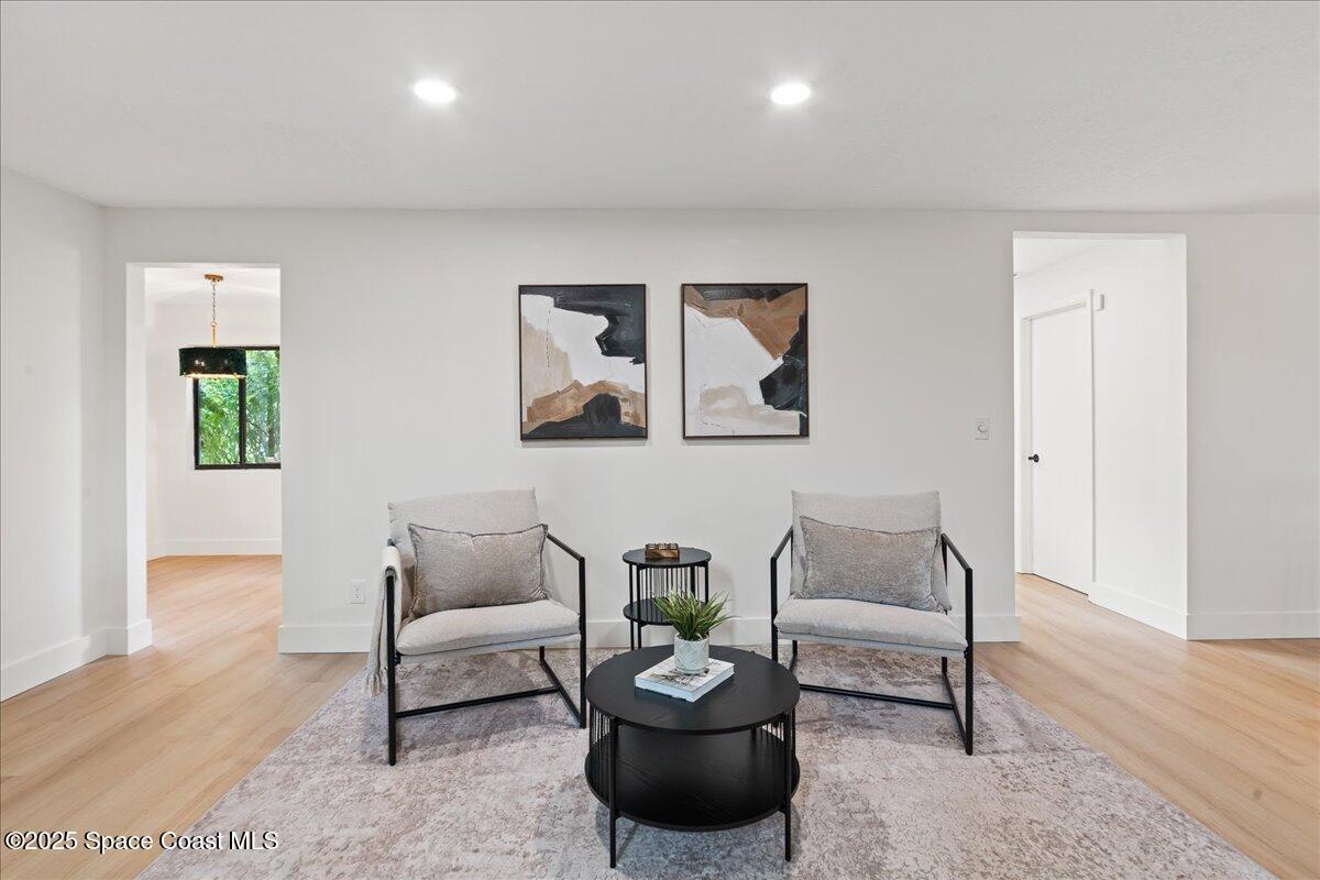 720 Wing Foot Lane Melbourne, FL 32940 - Photo 15 of 45 a living room with furniture and a wooden floor