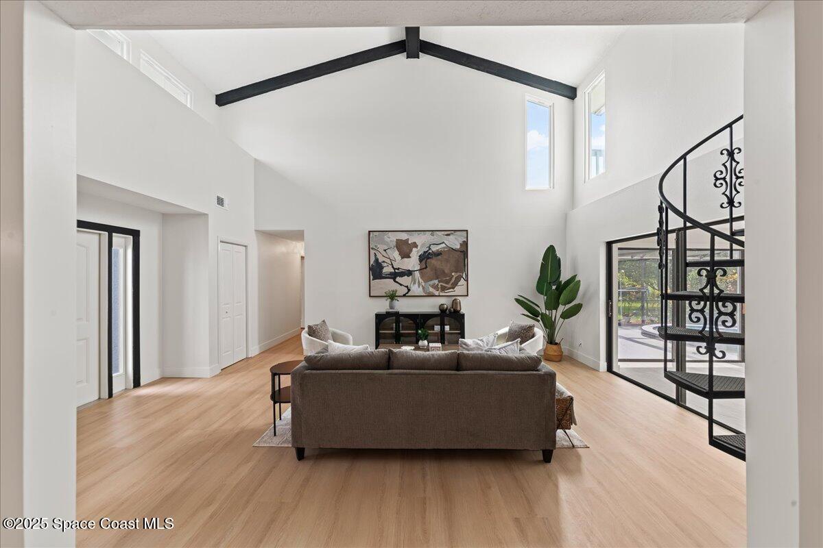 720 Wing Foot Lane Melbourne, FL 32940 - Photo 16 of 45 a living room with furniture and wooden floor