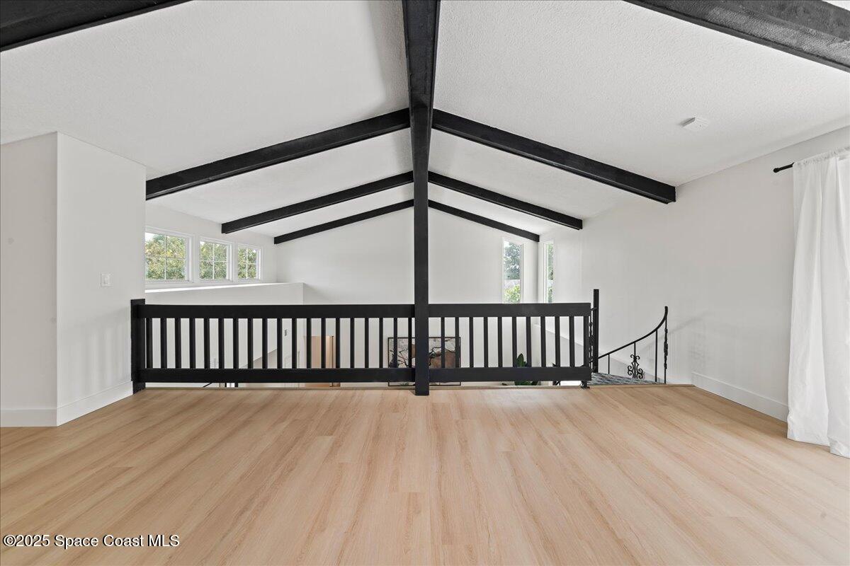 720 Wing Foot Lane Melbourne, FL 32940 - Photo 18 of 45 a view of staircase with railing and a window