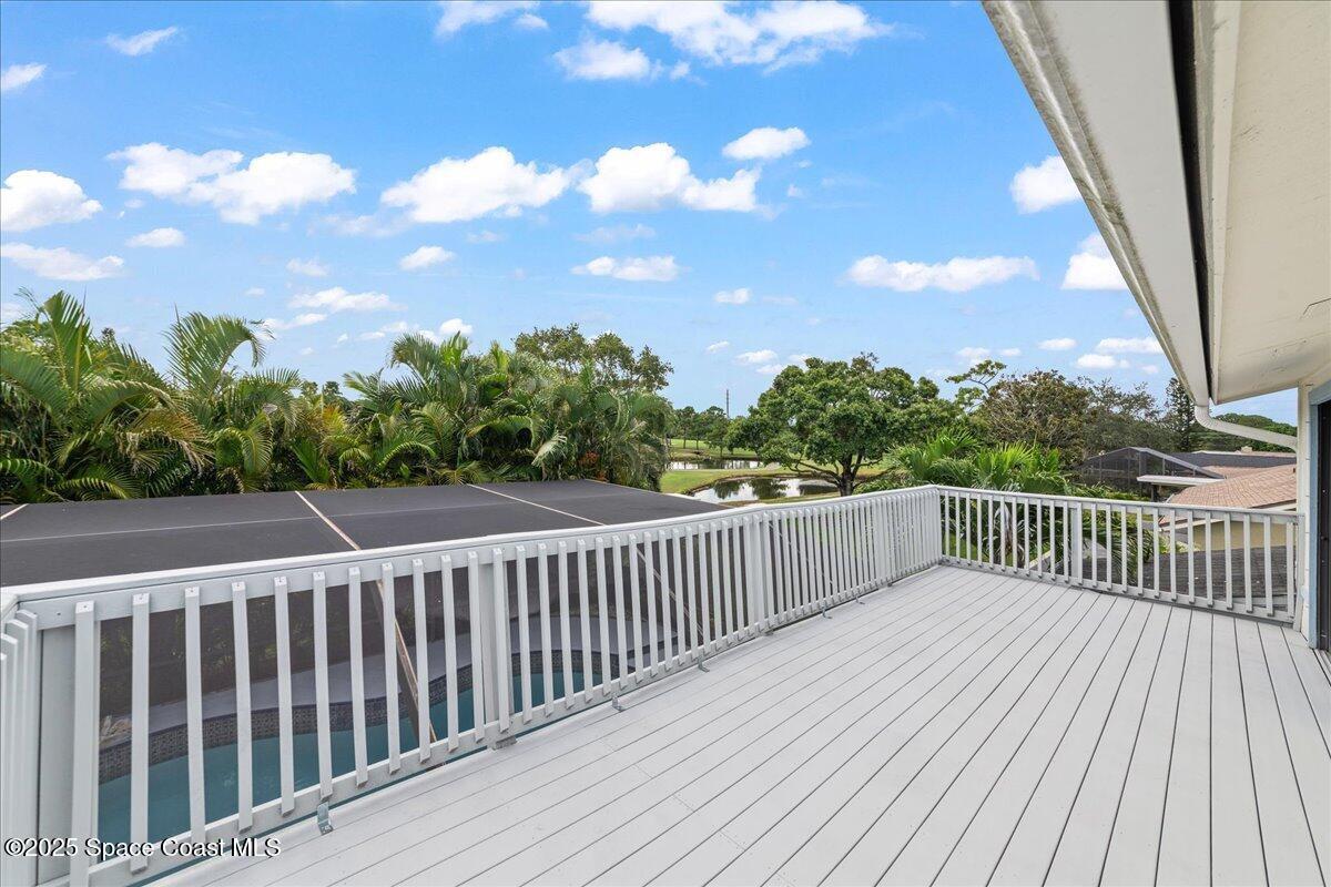 720 Wing Foot Lane Melbourne, FL 32940 - Photo 20 of 45 a balcony with wooden floor and fence