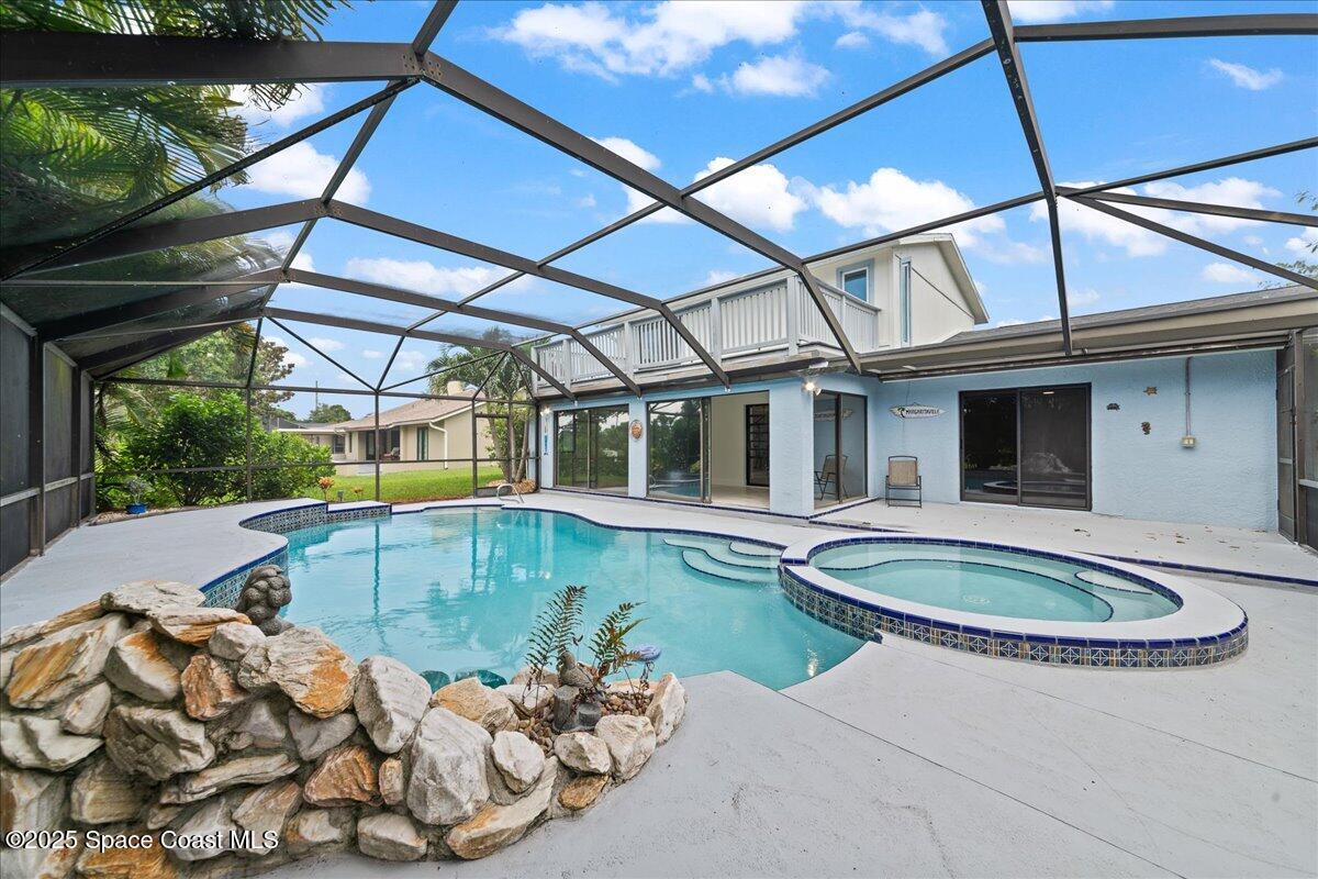 720 Wing Foot Lane Melbourne, FL 32940 - Photo 2 of 45 a view of a backyard with swimming pool