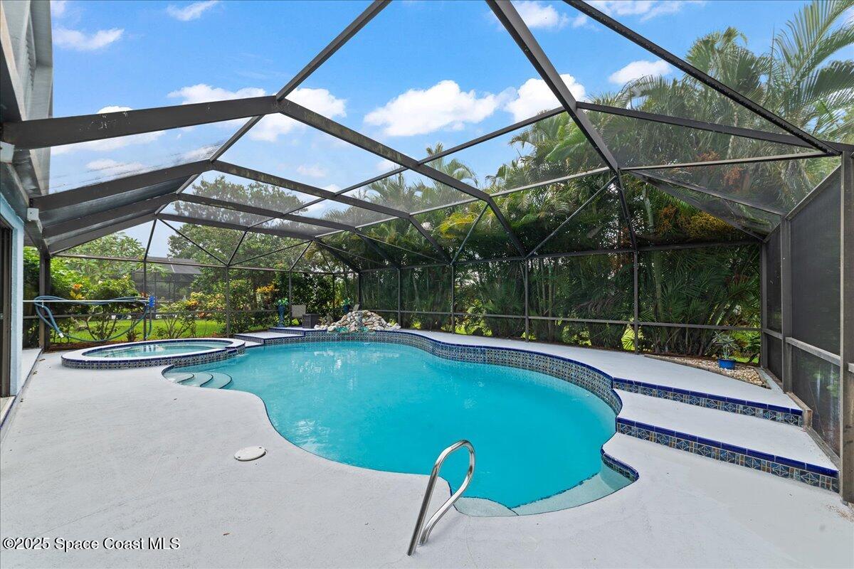 720 Wing Foot Lane Melbourne, FL 32940 - Photo 38 of 45 a view of a backyard with swimming pool