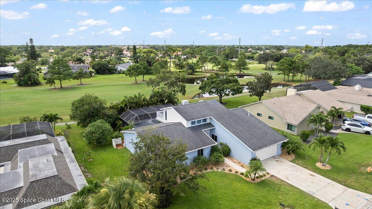 720 Wing Foot Lane Melbourne, FL 32940 - Photo 40 of 45 an aerial view of a house with outdoor space and street view