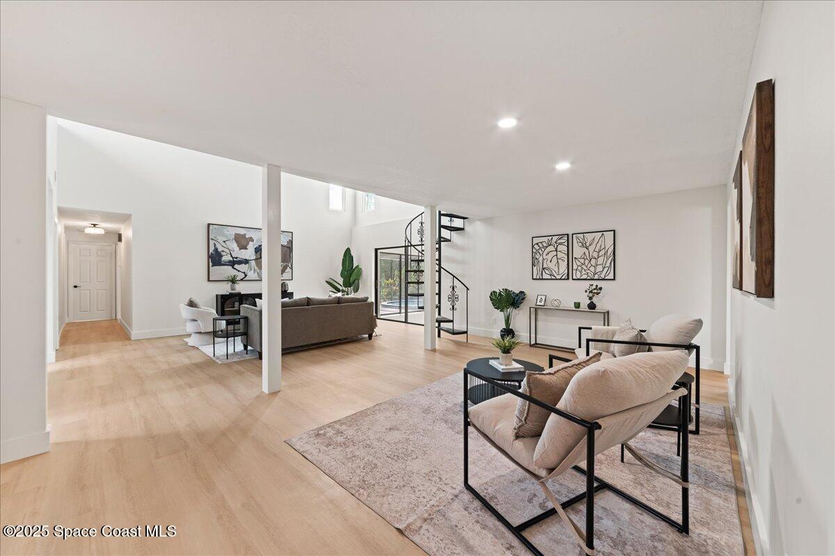 720 Wing Foot Lane Melbourne, FL 32940 - Photo 4 of 45 a living room with furniture and a flat screen tv