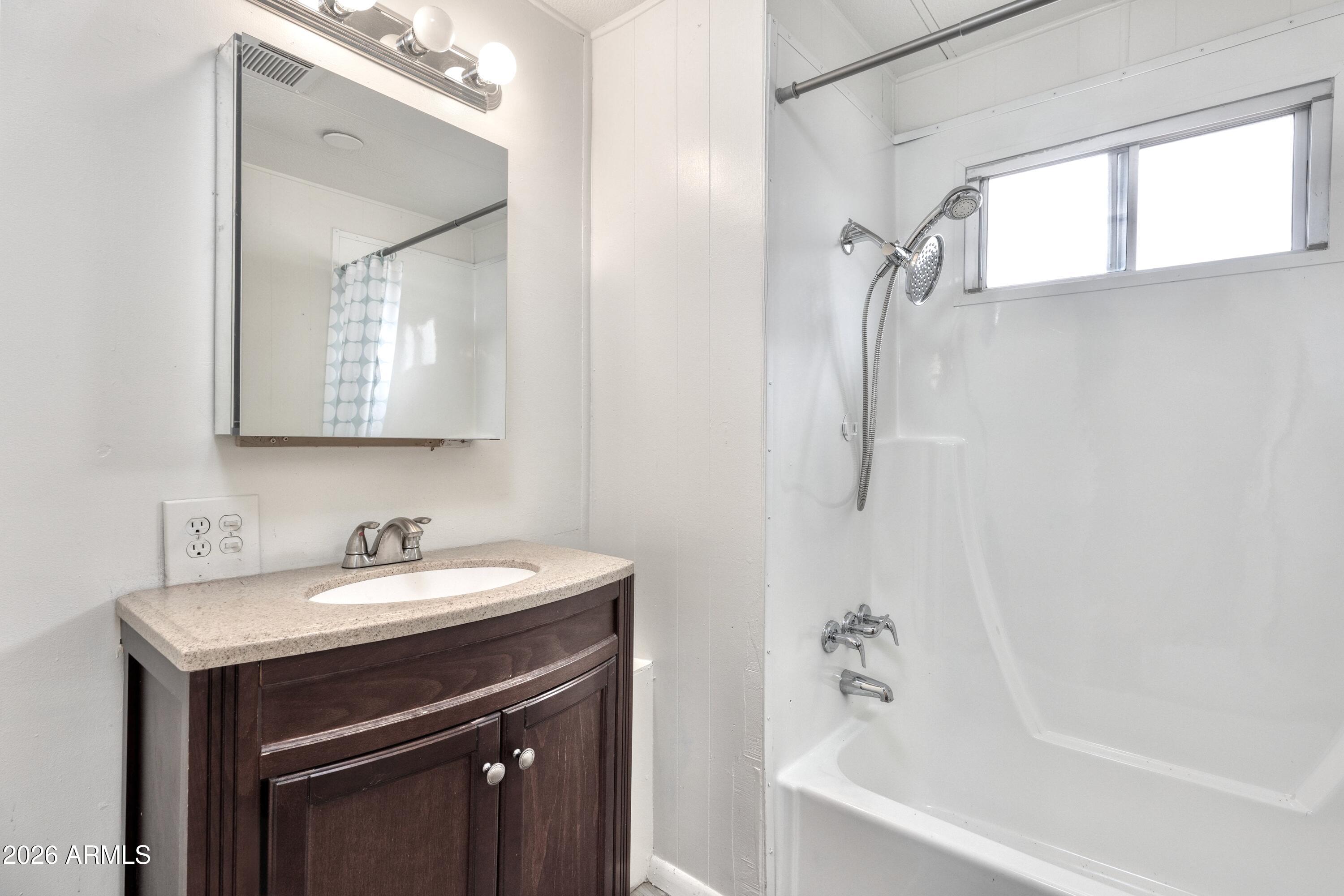 503 West Johnson Drive Payson, AZ 85541 - Photo 12 of 24 a bathroom with a sink and a mirror