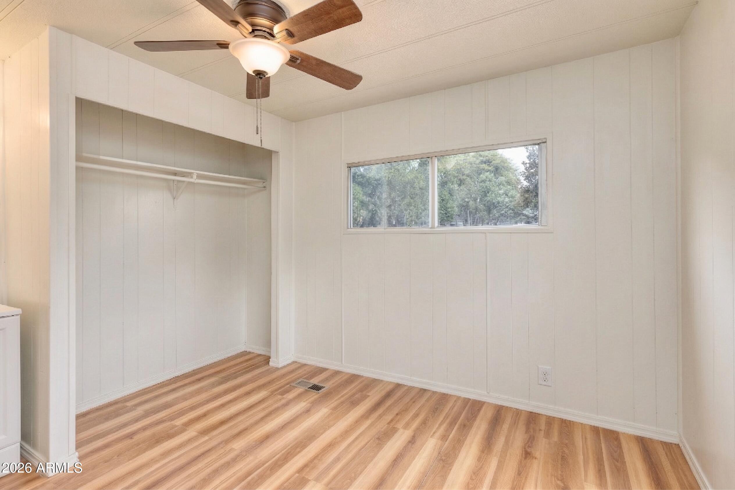 503 West Johnson Drive Payson, AZ 85541 - Photo 13 of 24 a view of a room with wooden floor and a ceiling fan