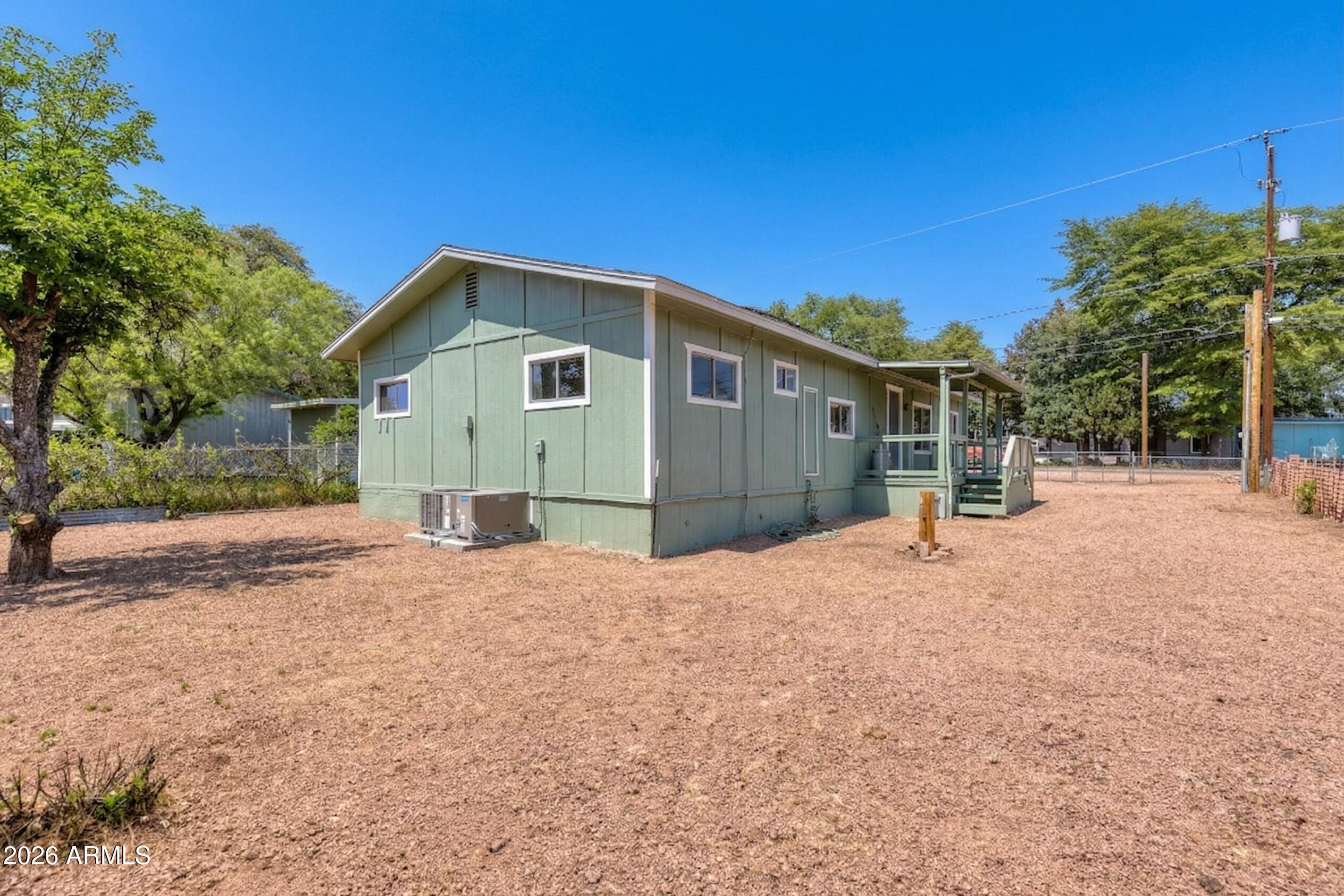 503 West Johnson Drive Payson, AZ 85541 - Photo 19 of 24 a front view of a house with a yard and garage