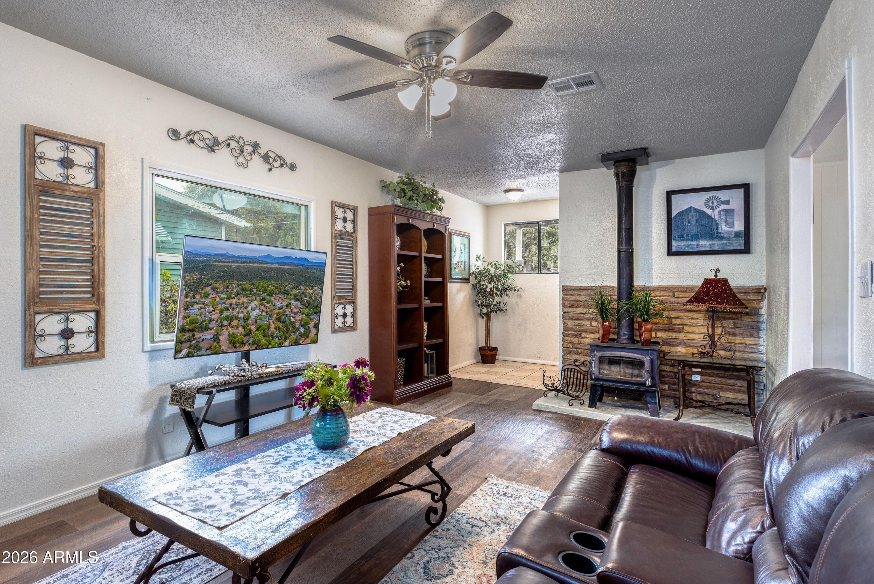 503 West Johnson Drive Payson, AZ 85541 - Photo 2 of 24 a living room with furniture and a flat screen tv