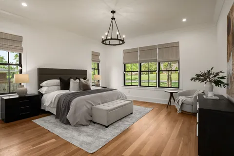 a bedroom with bed and a window