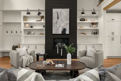 a living room with furniture kitchen view and a table