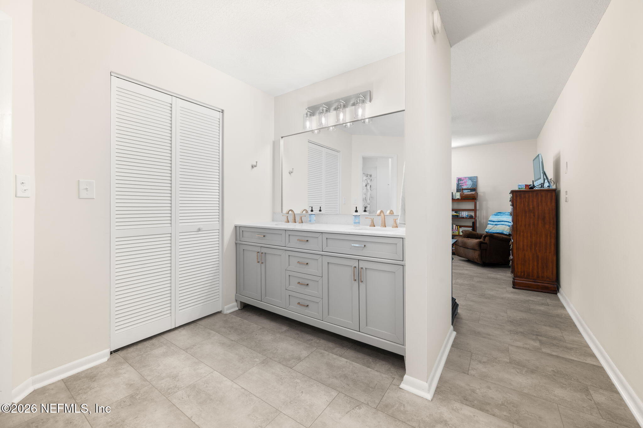 507 Gentian Road St. Augustine, FL 32086 - Photo 26 of 82 a spacious bathroom with a double vanity sink and a mirror