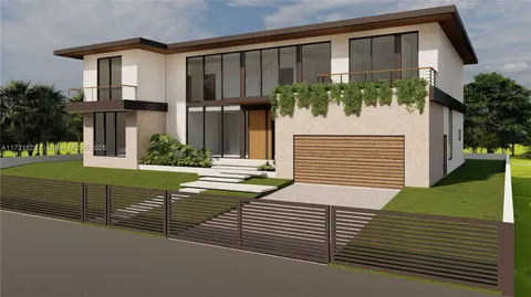 a view of a house with a small yard and plants