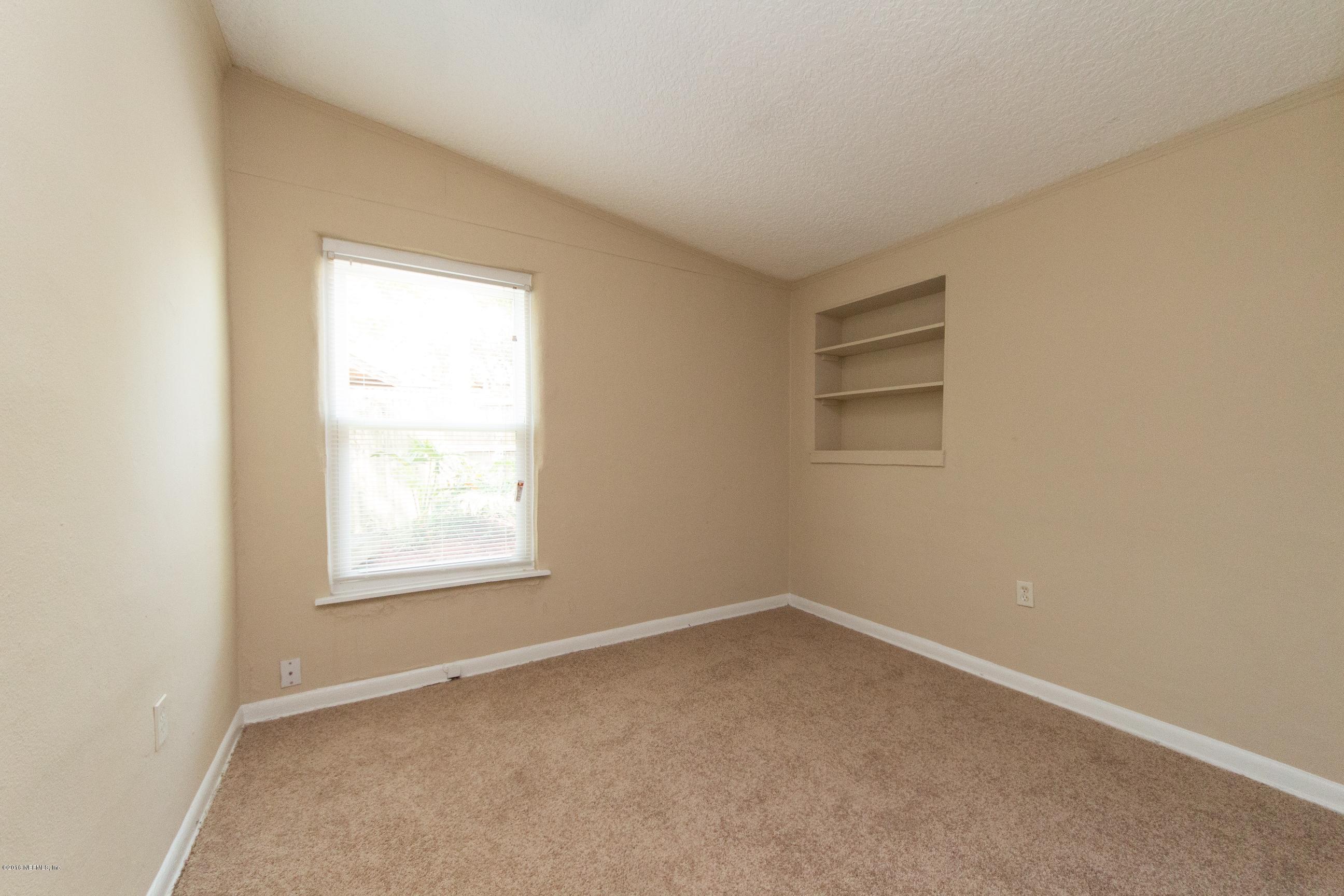 1702 Cortez Road Jacksonville, FL 32246 - Photo 13 of 24 an empty room with a window