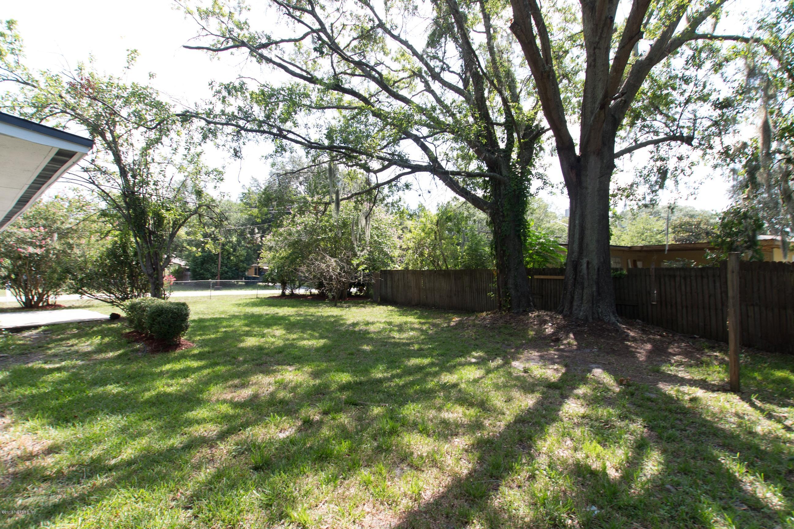 1702 Cortez Road Jacksonville, FL 32246 - Photo 18 of 24 a view of backyard with green space
