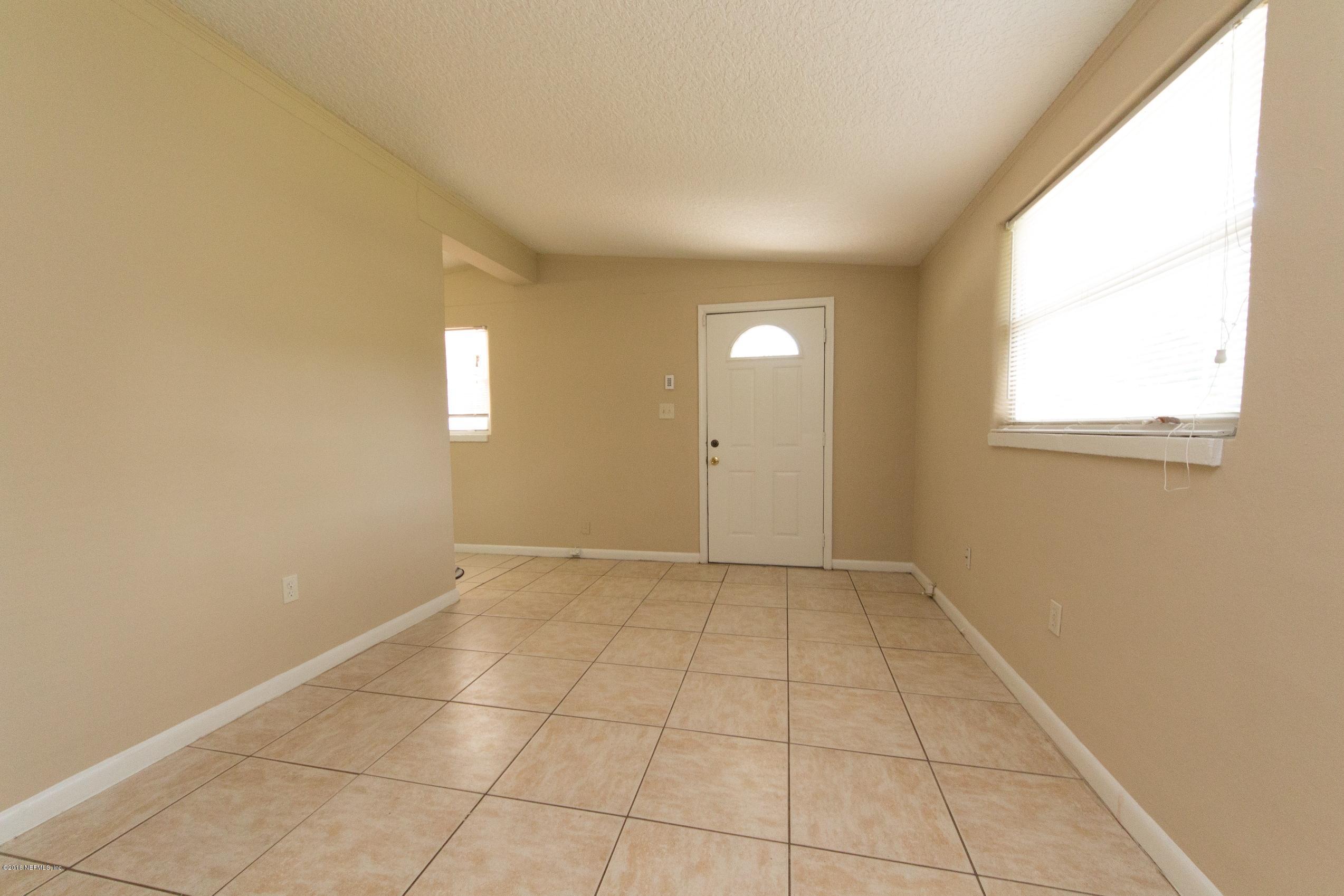 1702 Cortez Road Jacksonville, FL 32246 - Photo 20 of 24 an empty room with windows