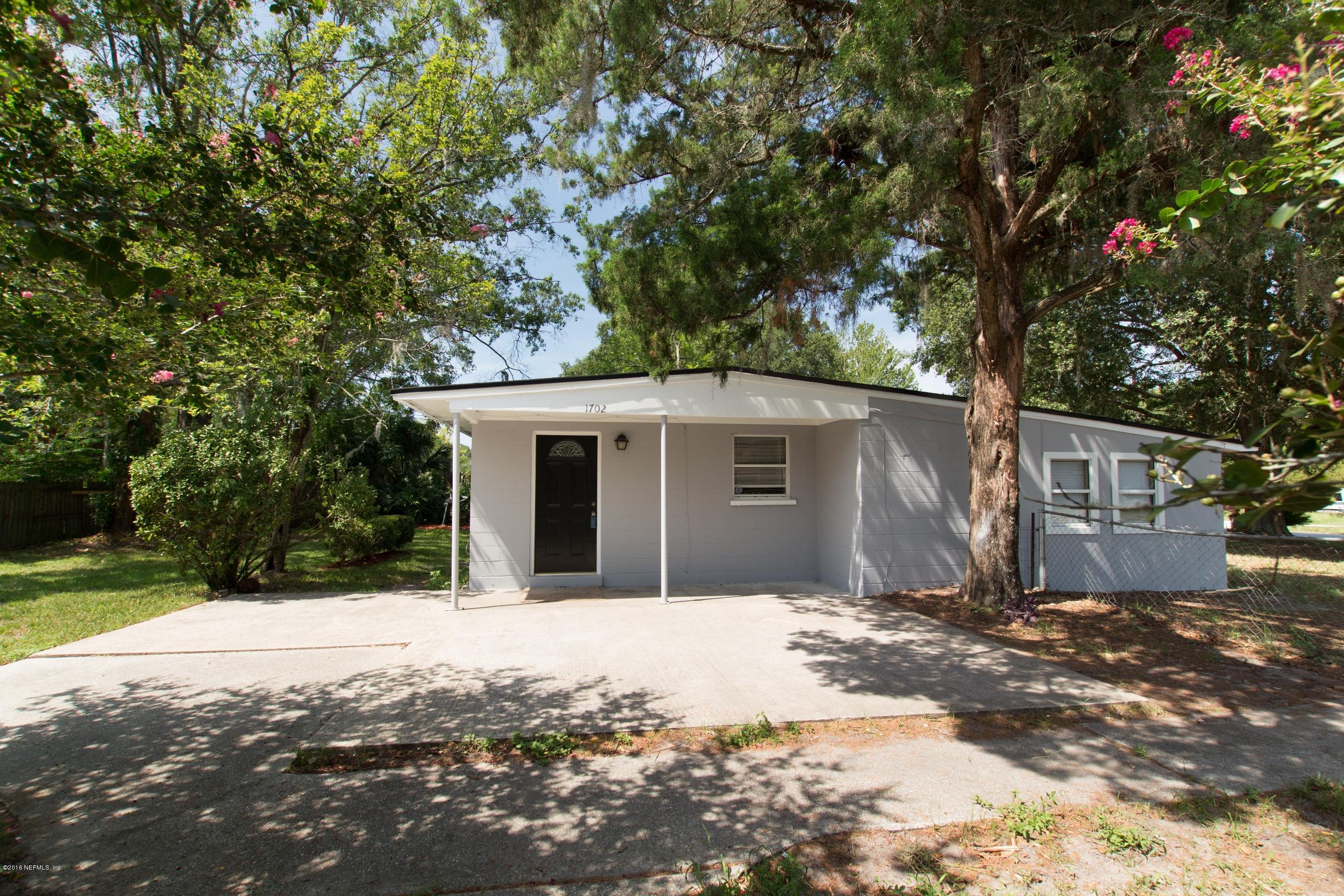 1702 Cortez Road Jacksonville, FL 32246 - Photo 2 of 24 a view of a house with a yard