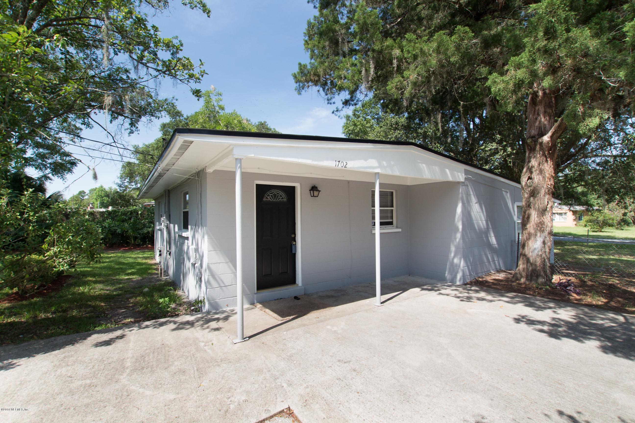 1702 Cortez Road Jacksonville, FL 32246 - Photo 3 of 24 a front view of a house with a yard