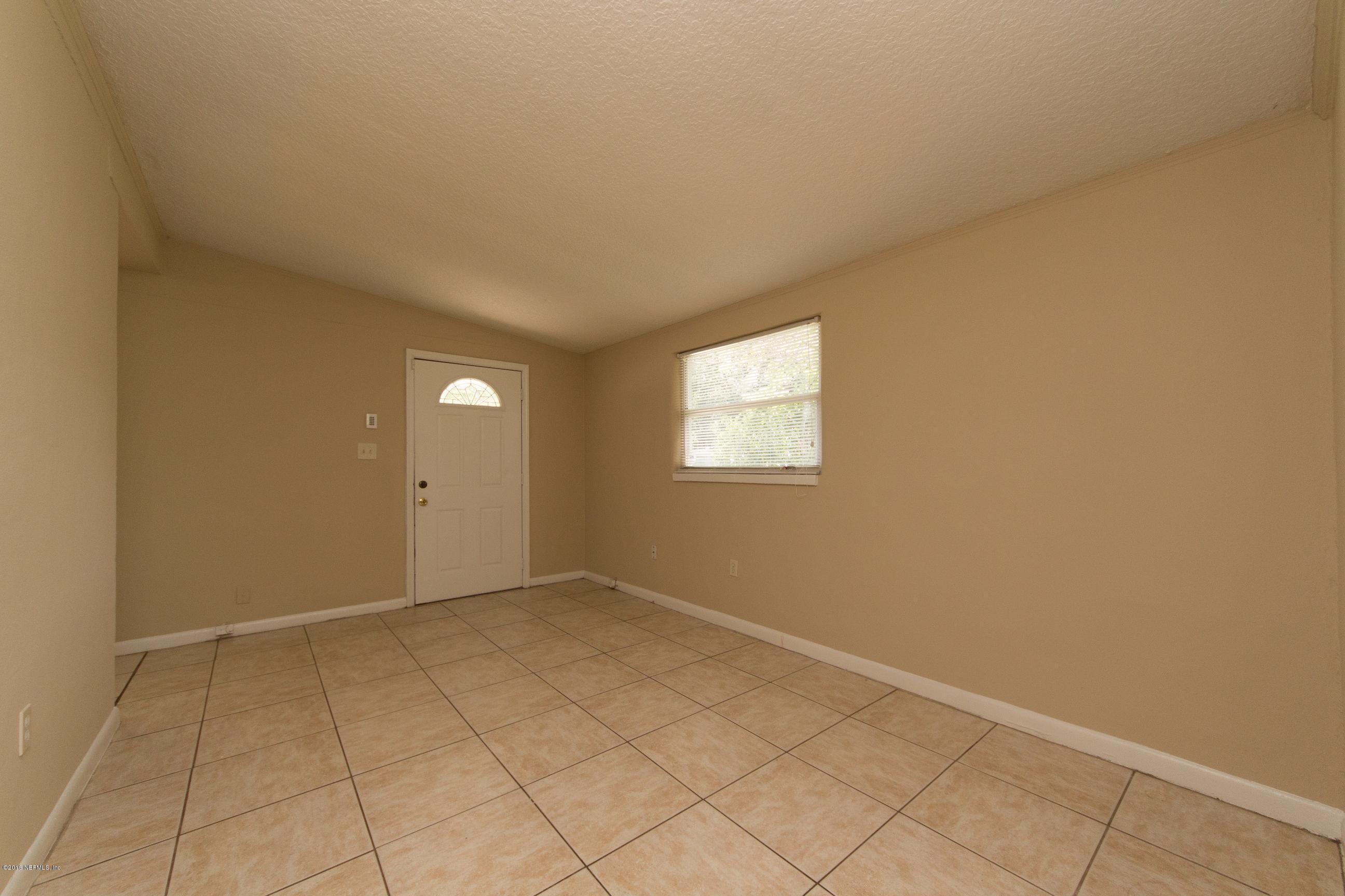 1702 Cortez Road Jacksonville, FL 32246 - Photo 4 of 24 a view of an empty room and window