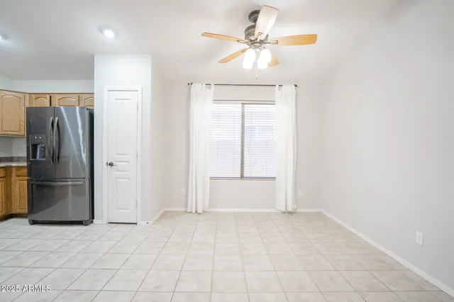 a kitchen with a sink a counter top space and stainless steel appliances