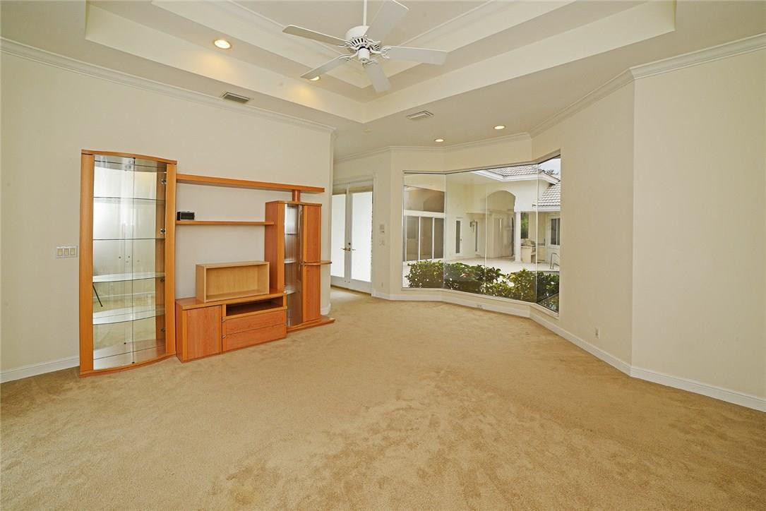 6039 Northwest 32nd Avenue Boca Raton, FL 33496 - Photo 12 of 18 a view of a livingroom with furniture a ceiling fan and window