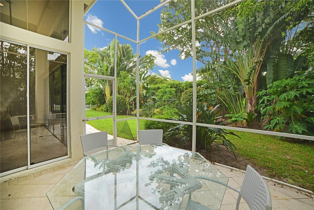 6039 Northwest 32nd Avenue Boca Raton, FL 33496 - Photo 15 of 18 a view of a chair and tables in the balcony