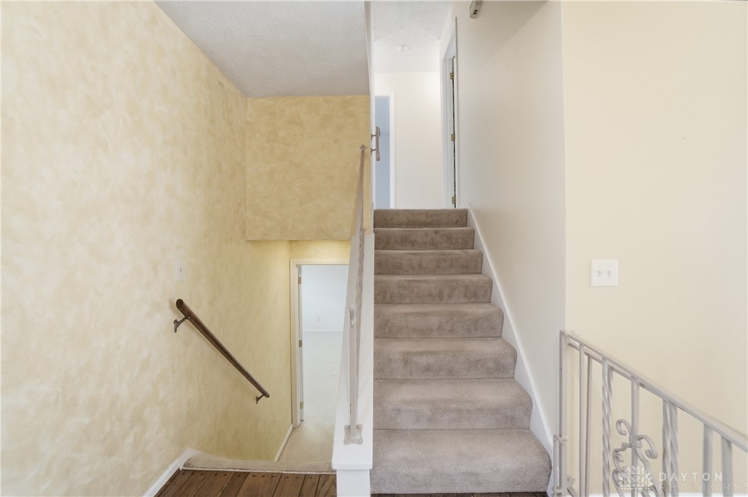 9964 Hummingbird Way Dayton, OH 45458 - Photo 29 of 57 This home features a well-maintained staircase, providing easy access to multiple levels.