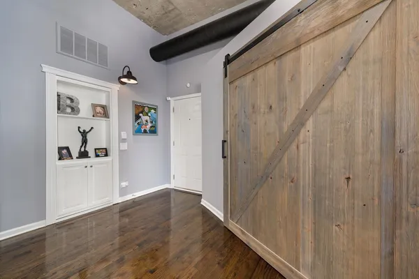 a view of entryway with wooden floor