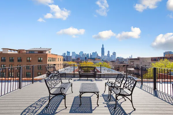 a view of a balcony with furniture