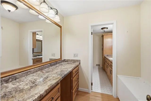 a view of a kitchen cabinets and a wooden floor