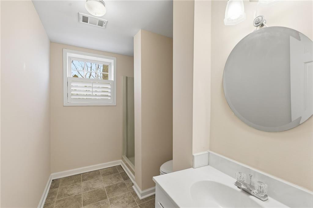 2224 Colonial Drive Gainesville, GA 30501 - Photo 29 of 40 a bathroom with a sink and a mirror