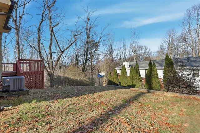 a view of a yard with snow on the road