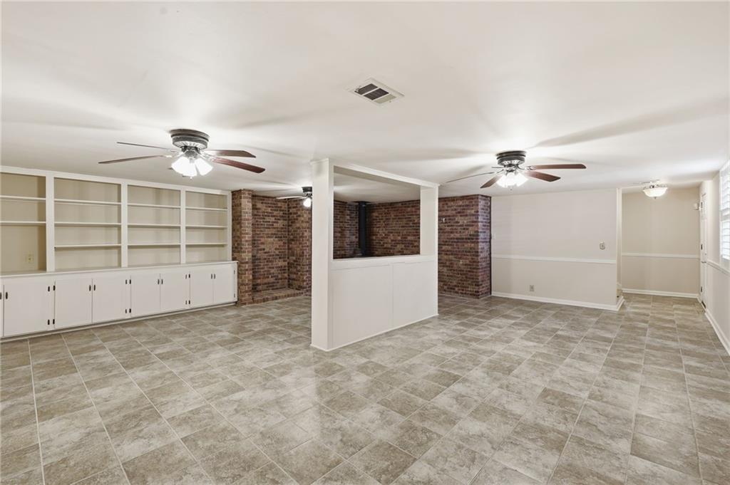 2224 Colonial Drive Gainesville, GA 30501 - Photo 39 of 40 an empty room with windows and cabinet