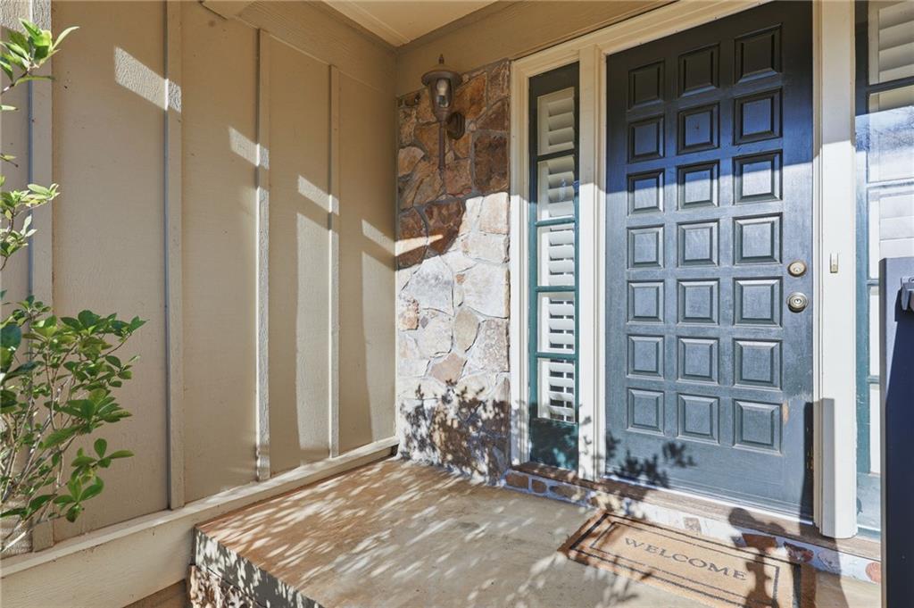 2224 Colonial Drive Gainesville, GA 30501 - Photo 8 of 40 a view of a house with a potted plant and floor to ceiling window and potted plants