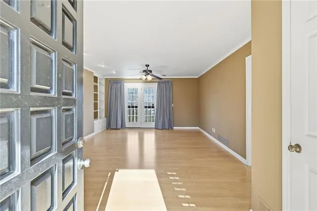 a view of an empty room with stairs