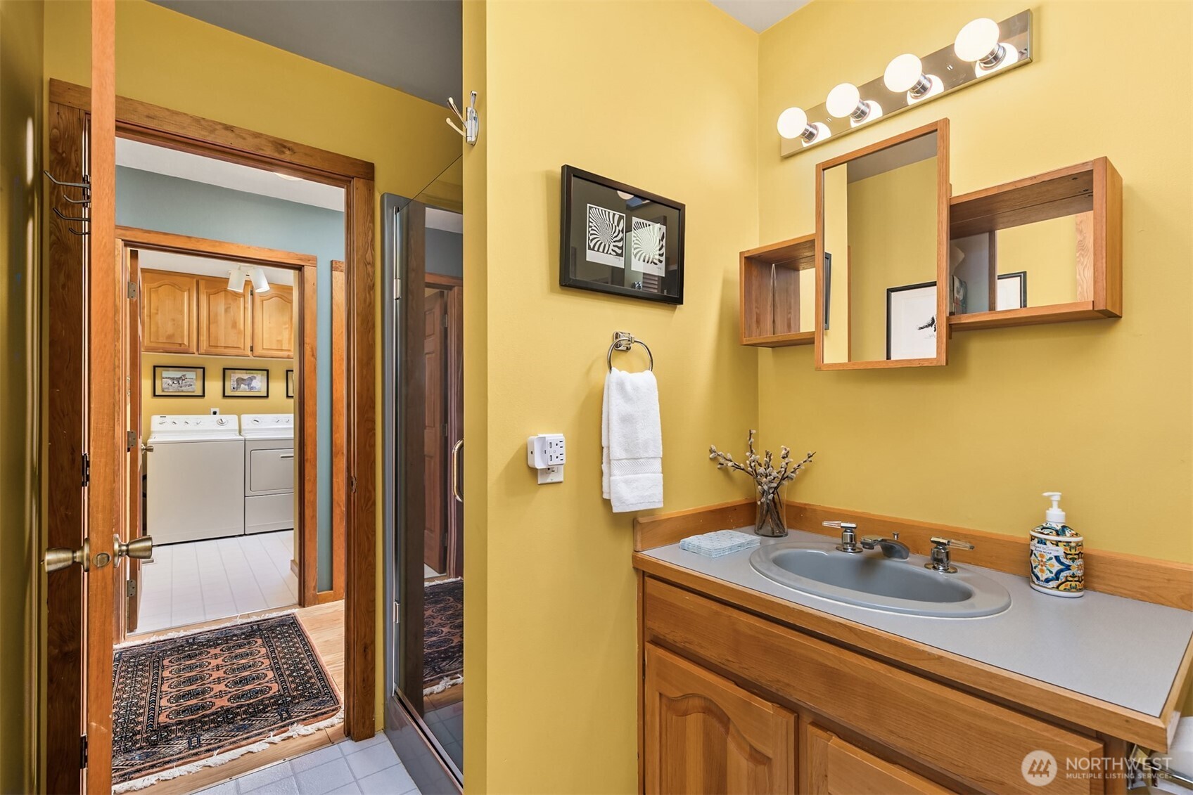 37695 Hansville Road Northeast Hansville, WA 98340 - Photo 15 of 37 a bathroom with a sink and a mirror