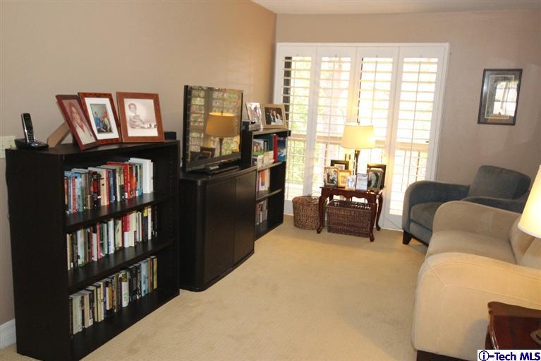 2041 Rosemont Avenue, Unit 2 Pasadena, CA 91103 - Photo 12 of 18 a living room with furniture a window and a book shelf