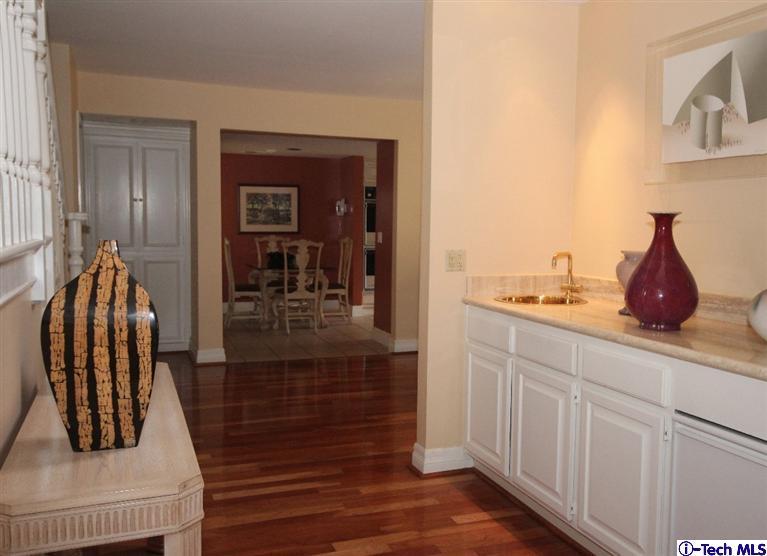 2041 Rosemont Avenue, Unit 2 Pasadena, CA 91103 - Photo 4 of 18 a hallway with a view of living room with wooden floor