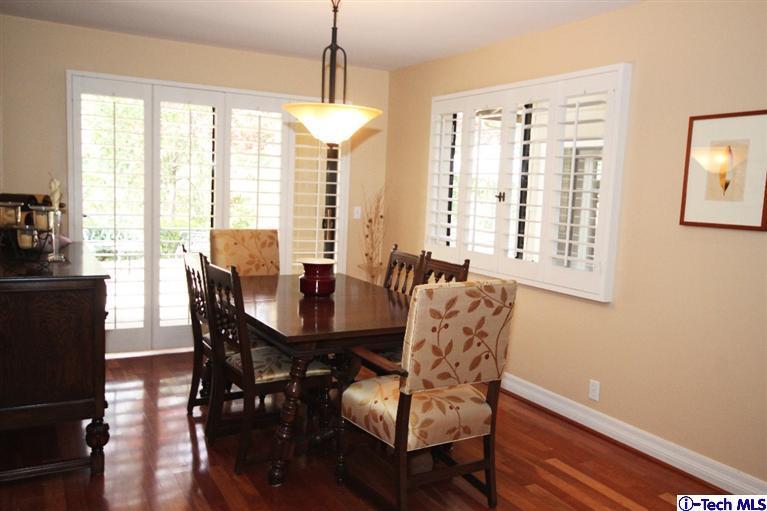 2041 Rosemont Avenue, Unit 2 Pasadena, CA 91103 - Photo 6 of 18 a dining room with furniture a chandelier and wooden floor
