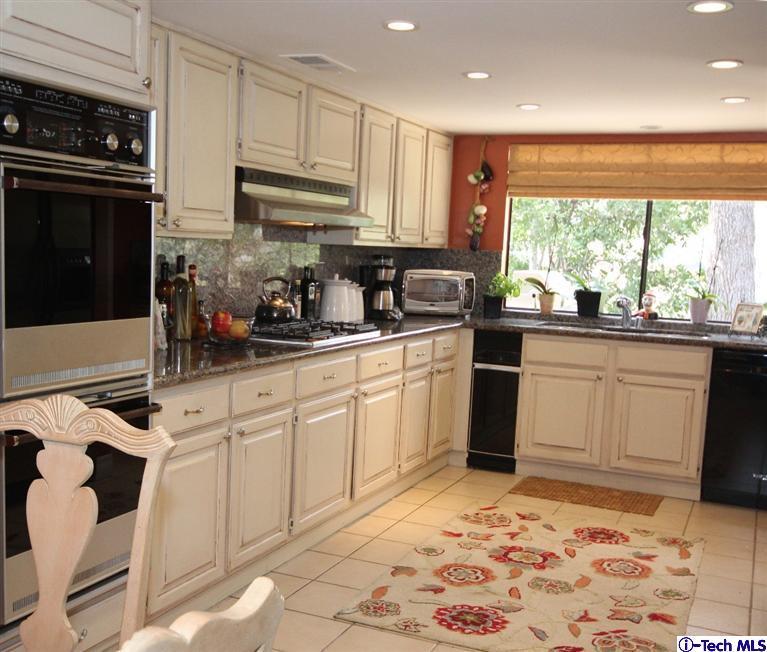 2041 Rosemont Avenue, Unit 2 Pasadena, CA 91103 - Photo 7 of 18 a kitchen with stainless steel appliances granite countertop a sink stove and refrigerator