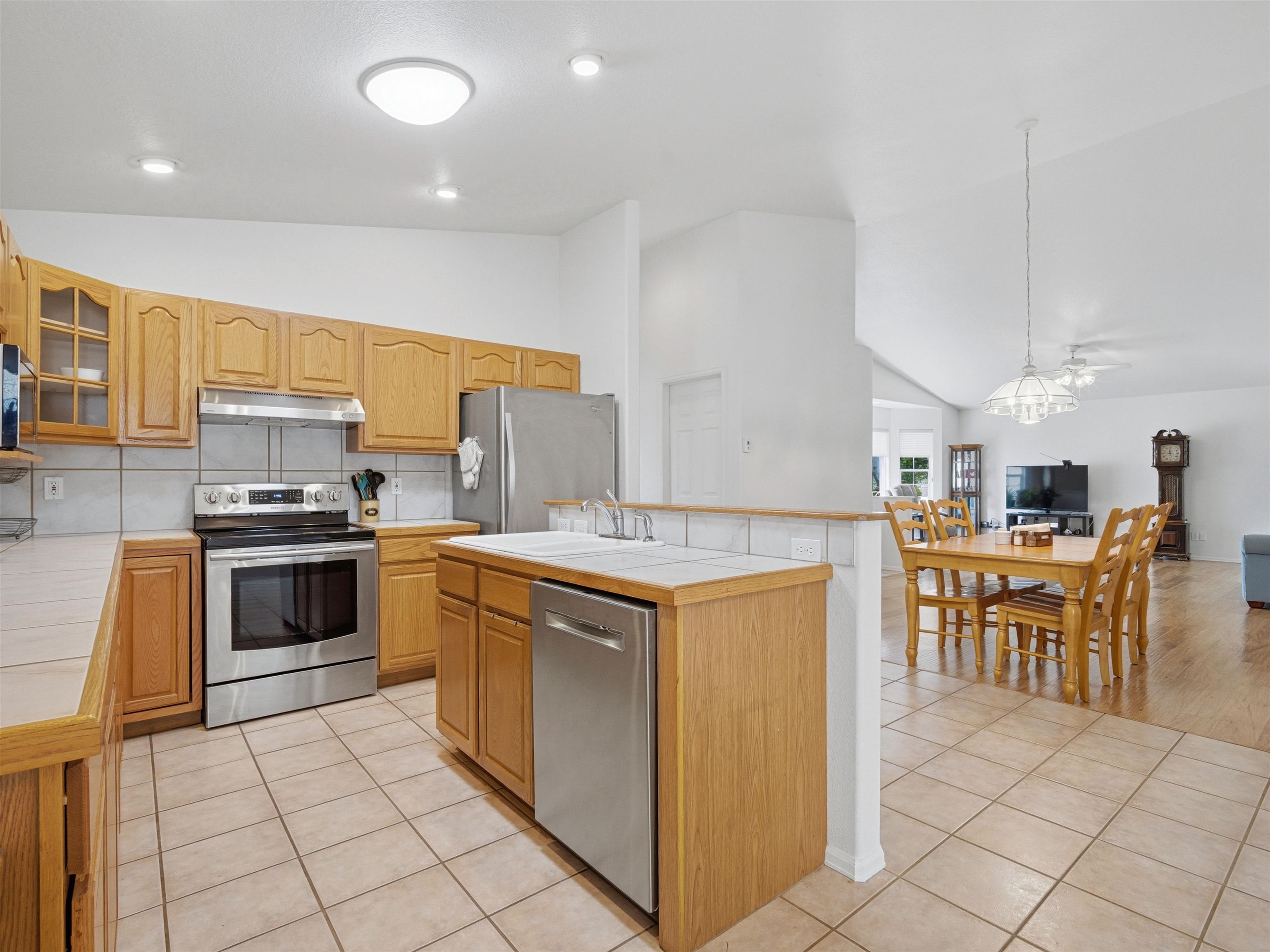 3082 Shadowbrook Court Grand Junction, CO 81504 - Photo 9 of 28 a kitchen with a stove sink cabinets and stainless steel appliances