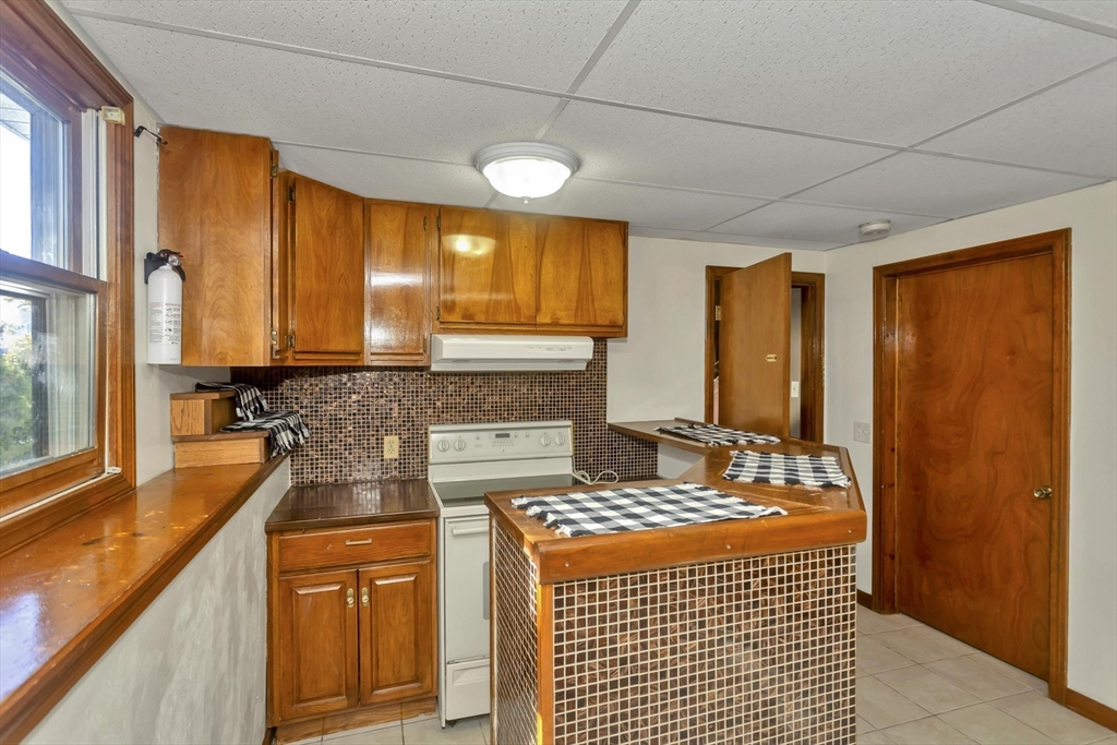 212 Poplar Street Chicopee, MA 01013 - Photo 14 of 22 a large kitchen with a large window