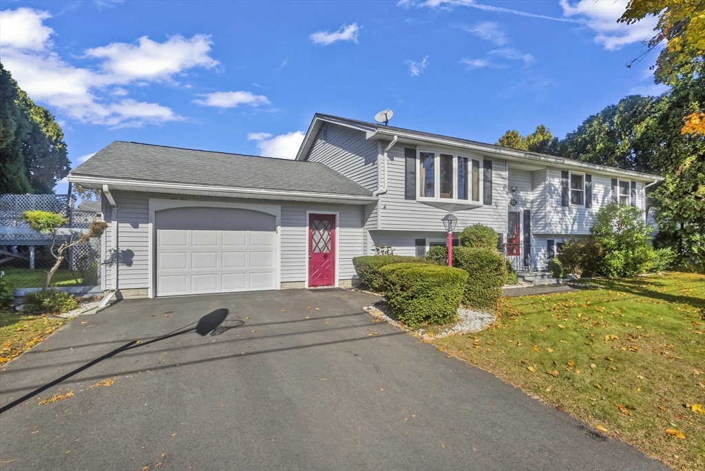 212 Poplar Street Chicopee, MA 01013 - Photo 22 of 22 front view of house with a yard