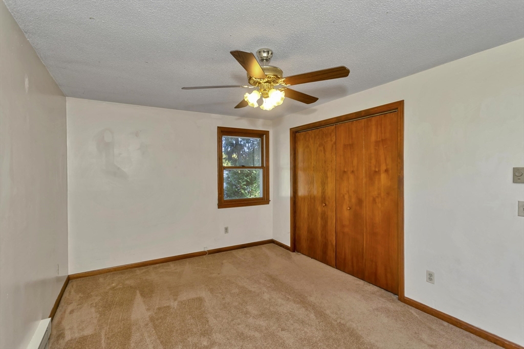 212 Poplar Street Chicopee, MA 01013 - Photo 9 of 22 a view of an empty room and a window