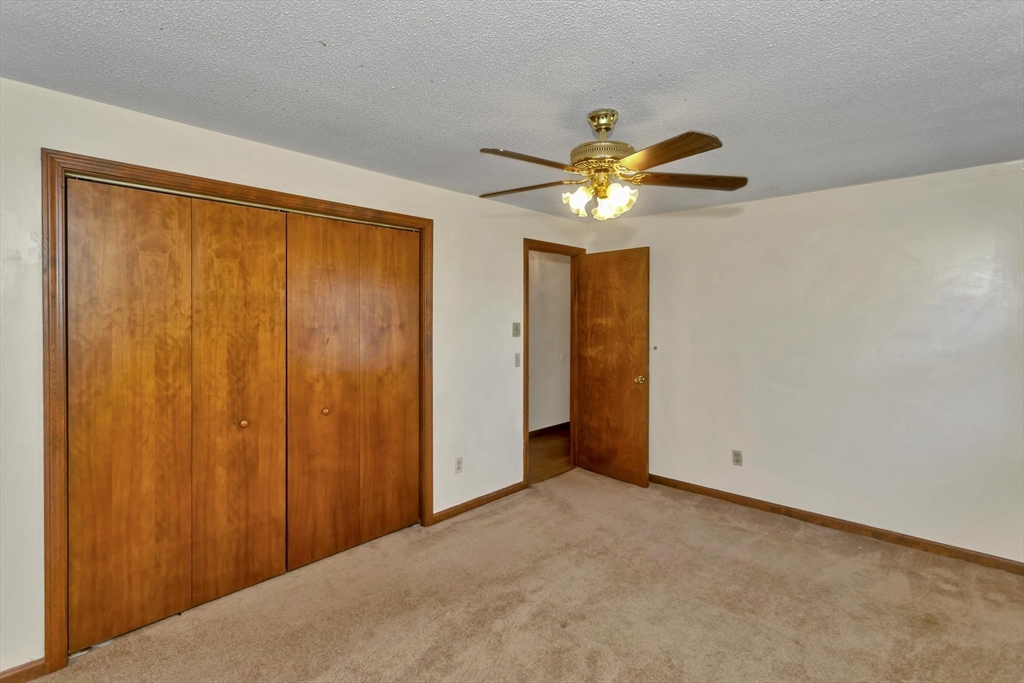 212 Poplar Street Chicopee, MA 01013 - Photo 10 of 22 a view of an empty room with a window