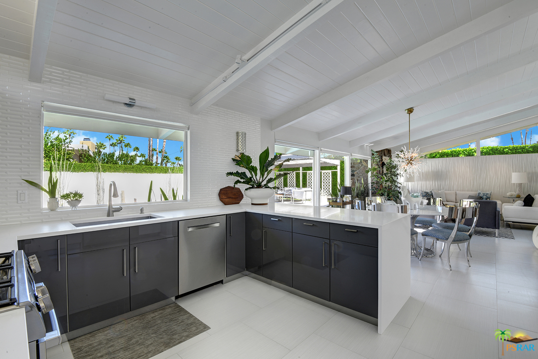984 East La Jolla Road Palm Springs, CA 92264 - Photo 13 of 53 a kitchen with a sink and cabinets
