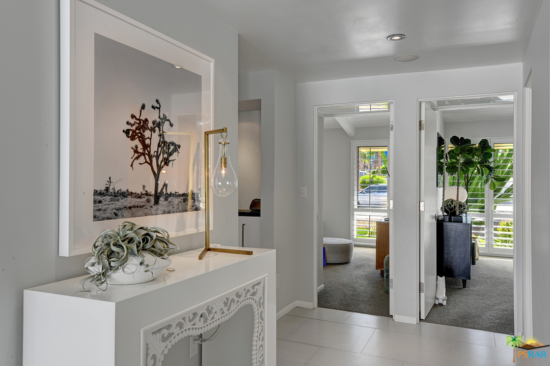 984 East La Jolla Road Palm Springs, CA 92264 - Photo 16 of 53 a bathroom with a sink vanity and a mirror